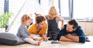 A family reading a book together
